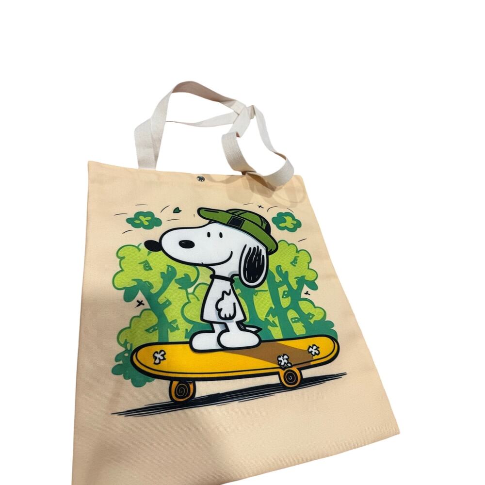 Snoopy canvas tote bag Snoopy on a skateboard with green trees